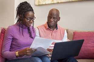 Man and woman looking at laptop